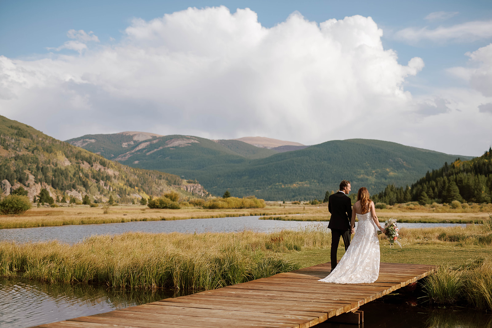 Couple at Destination wedding on dock in Colorado