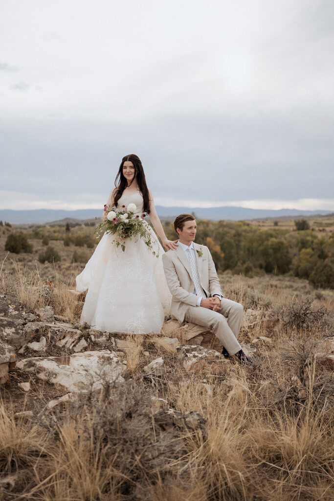 Bride and groom posing in Wyoming plains